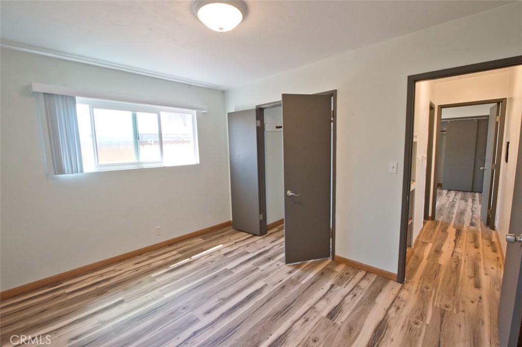 156 West Escalones San Clemente, CA 92672 - Photo 21 of 39 a view of an empty room with wooden floor and a window