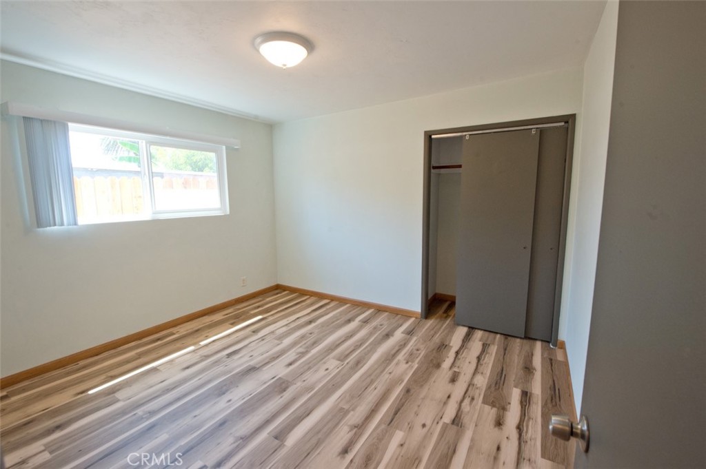 156 West Escalones San Clemente, CA 92672 - Photo 23 of 39 a view of an empty room with wooden floor and a window