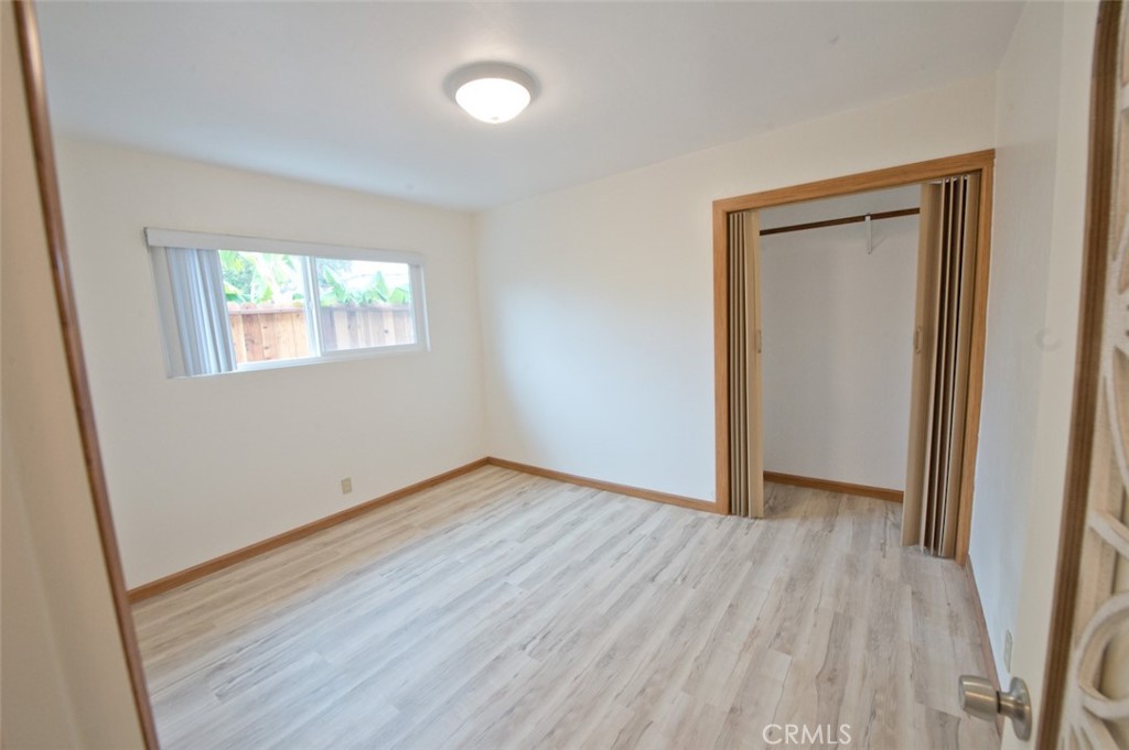 156 West Escalones San Clemente, CA 92672 - Photo 32 of 39 an empty room with wooden floor and windows
