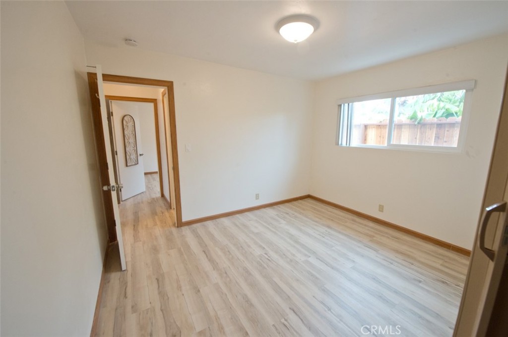 156 West Escalones San Clemente, CA 92672 - Photo 34 of 39 an empty room with wooden floor and a window