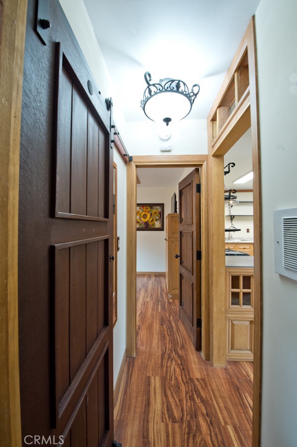 156 West Escalones San Clemente, CA 92672 - Photo 7 of 39 a view of a hallway with wooden floor and staircase