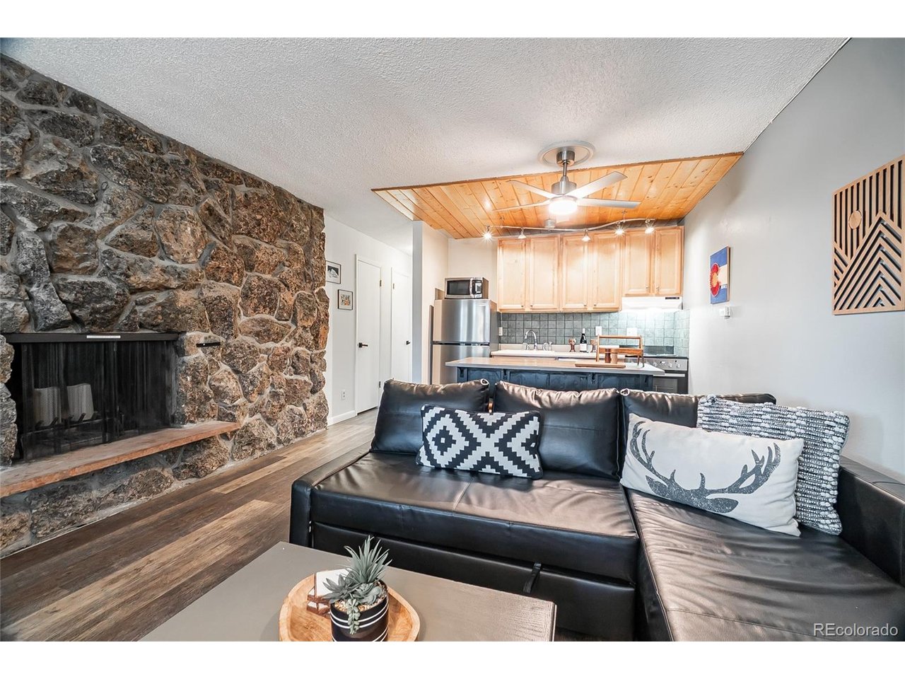 400 Hi Country Drive, Unit 15 Winter Park, CO 80482 - Photo 35 of 35 Wood burning fireplace and open floor plan