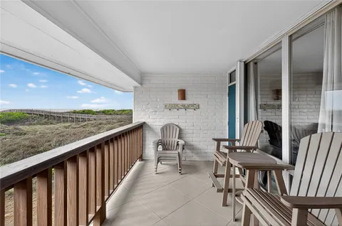 a view of balcony with furniture