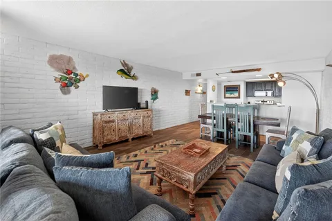 a living room with furniture and flat screen tv