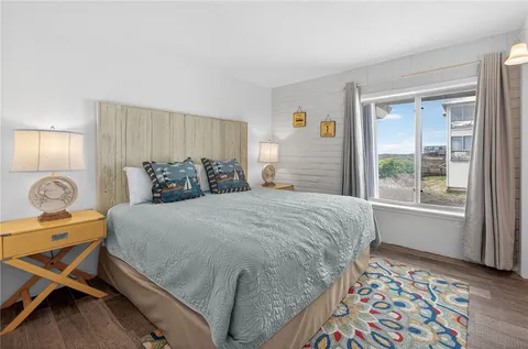 a bed room with a bed and a lamp