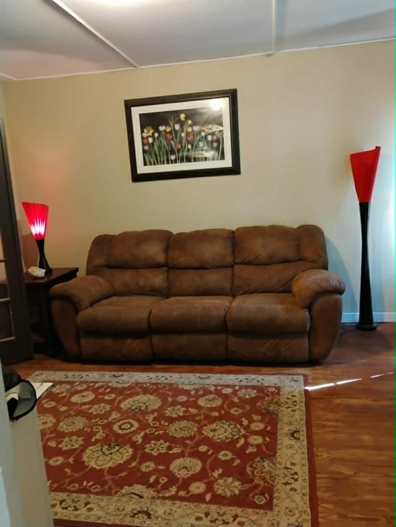 763 Frontier Street Bowie, TX 76230 - Photo 14 of 28 a living room with furniture and a couch