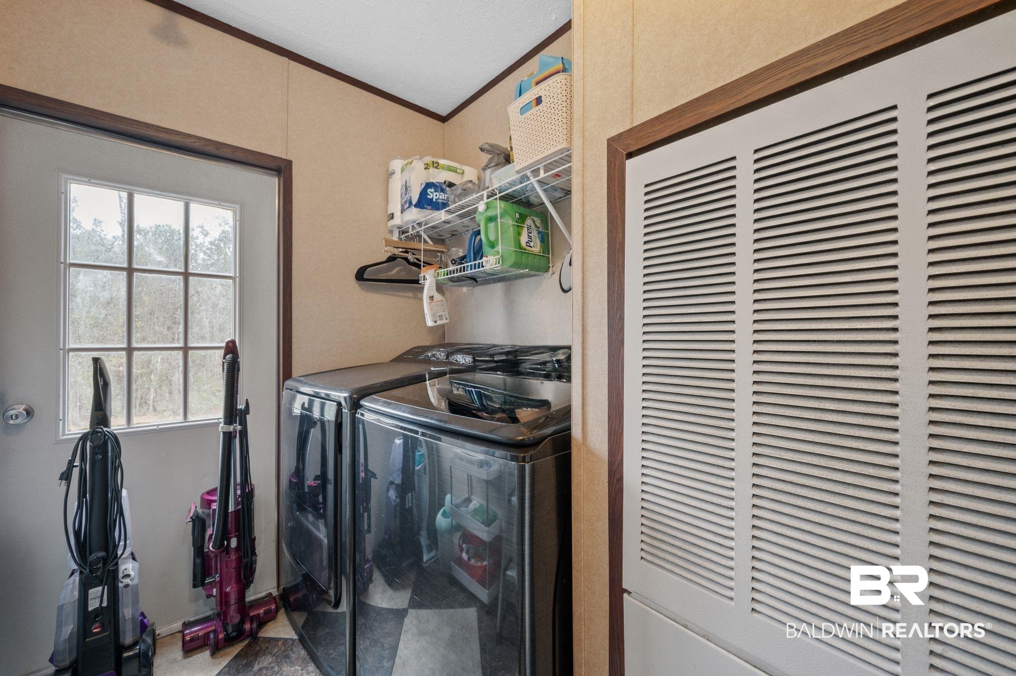 39908 T A Chastang Road Bay Minette, AL 36507 - Photo 17 of 20 Laundry room with laundry area, a heating unit, separate washer and dryer, and crown molding