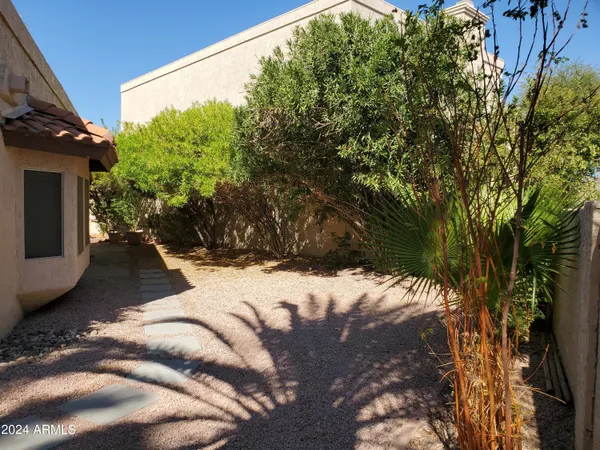 a view of a backyard of the house
