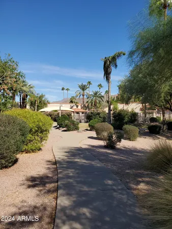 a view of a swimming pool with outdoor seating
