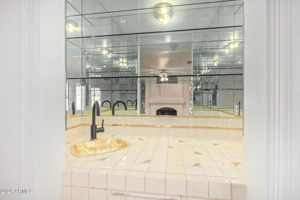 a view of a bathroom with mirror