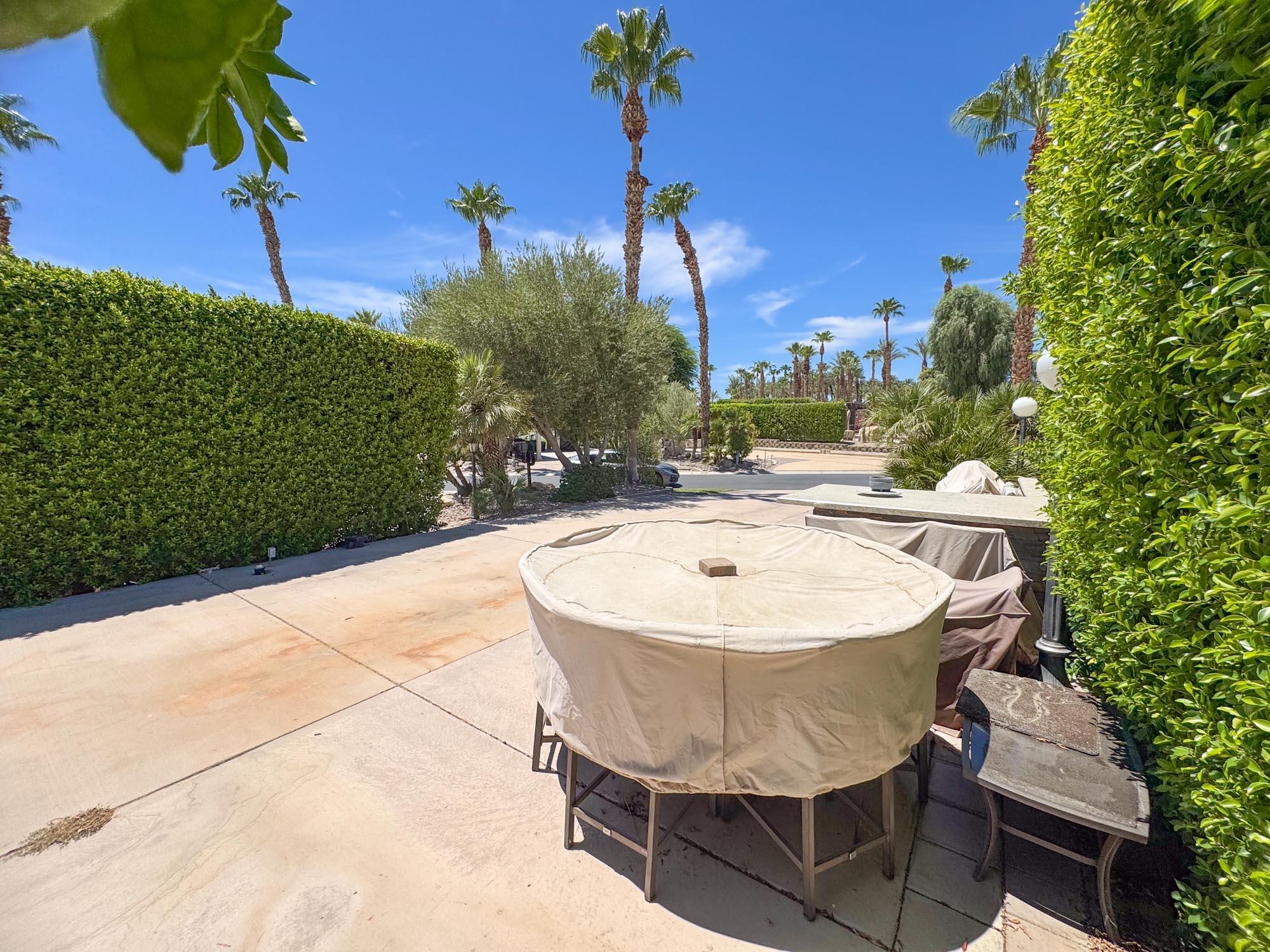 80394 Ave 48, Unit 423 Indio, CA 92201 - Photo 15 of 18 a view of a swimming pool with a patio