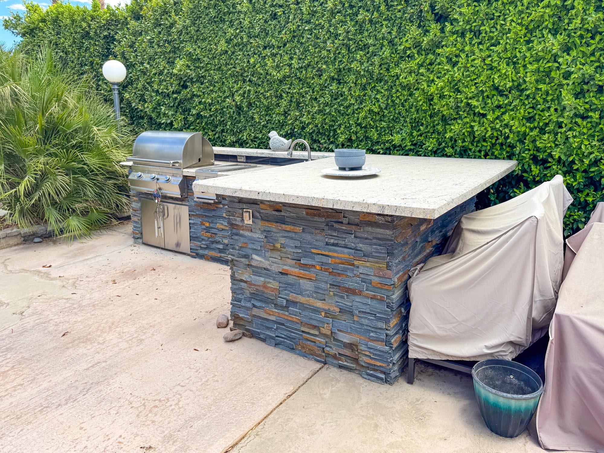 80394 Ave 48, Unit 423 Indio, CA 92201 - Photo 2 of 18 a view of a patio with table and chairs