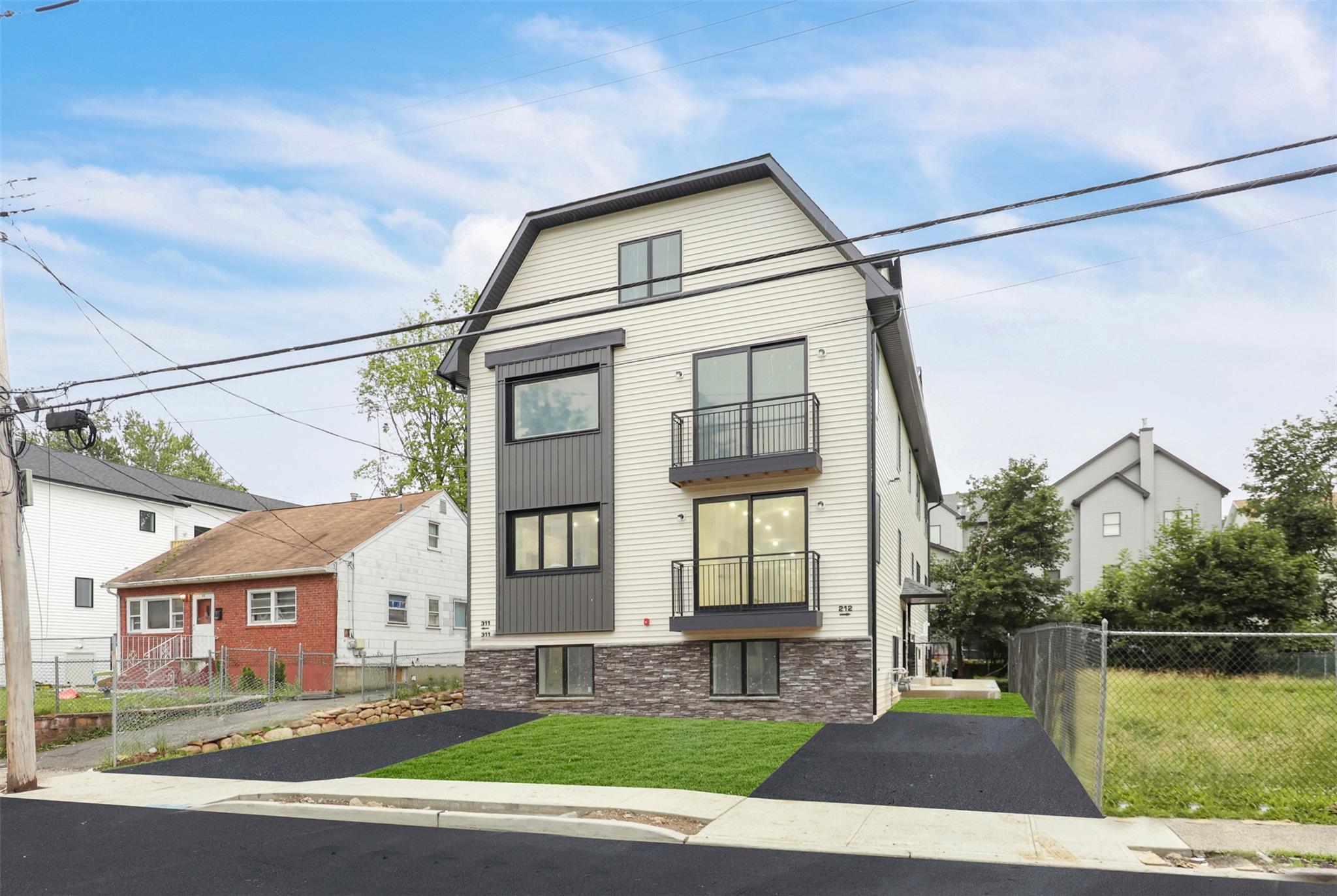 a front view of a house with a garden