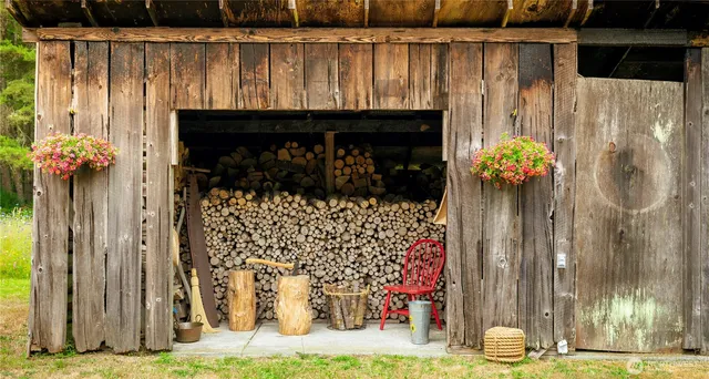a view of a chair and table in the garden
