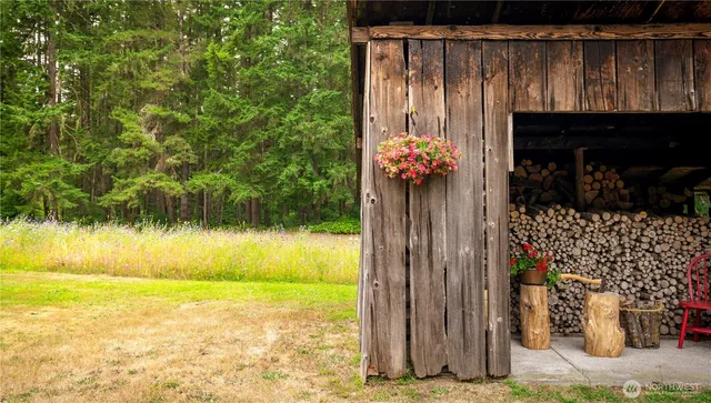 a living room with a couch and a table with wooden floor