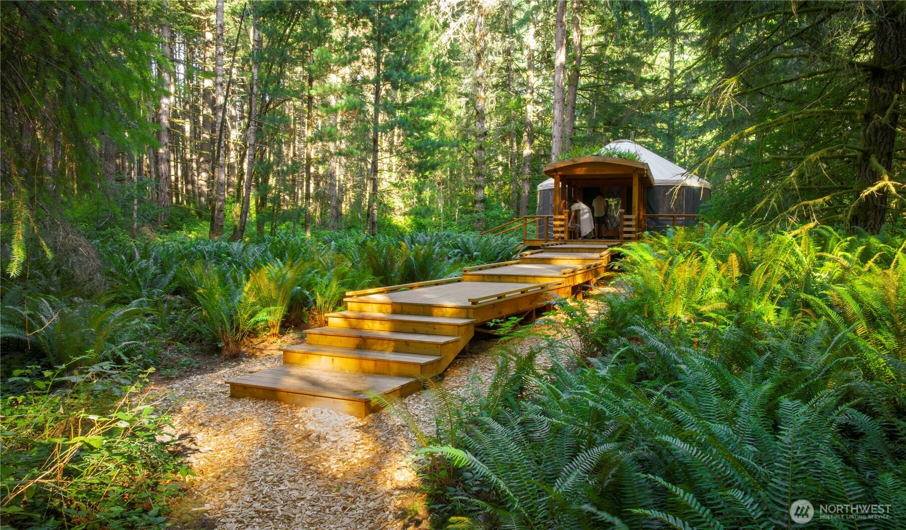 19680 Noll Road Northeast Poulsbo, WA 98370 - Photo 17 of 37 a backyard of a house with yard and outdoor seating