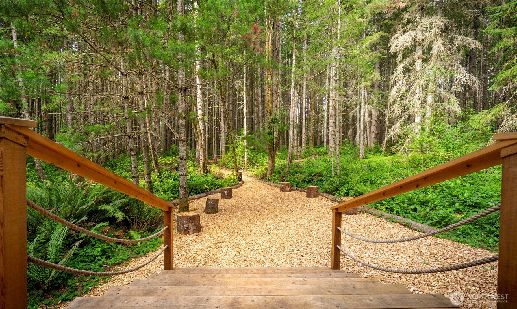 19680 Noll Road Northeast Poulsbo, WA 98370 - Photo 18 of 37 a view of a chair and table in the garden