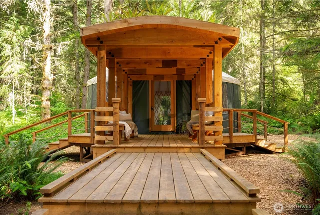 a backyard of house with a yard and seating space