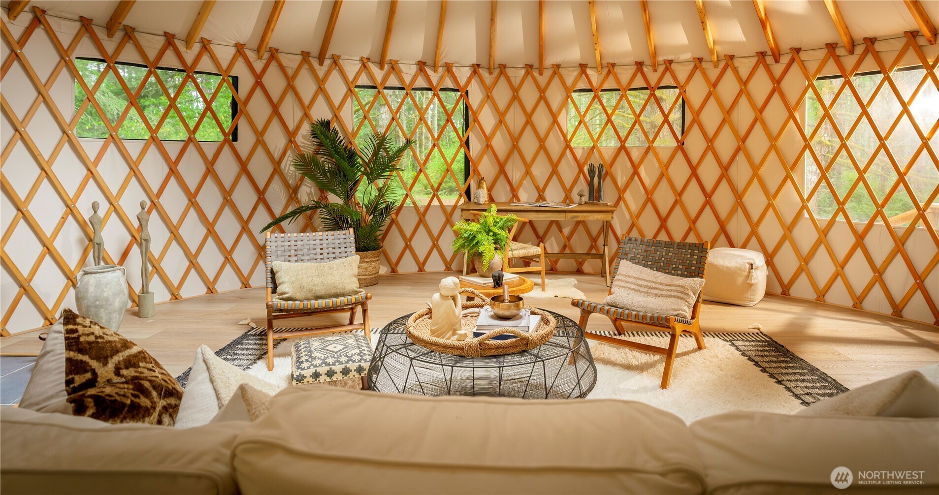 19680 Noll Road Northeast Poulsbo, WA 98370 - Photo 21 of 37 a living room with a couch and a table with wooden floor