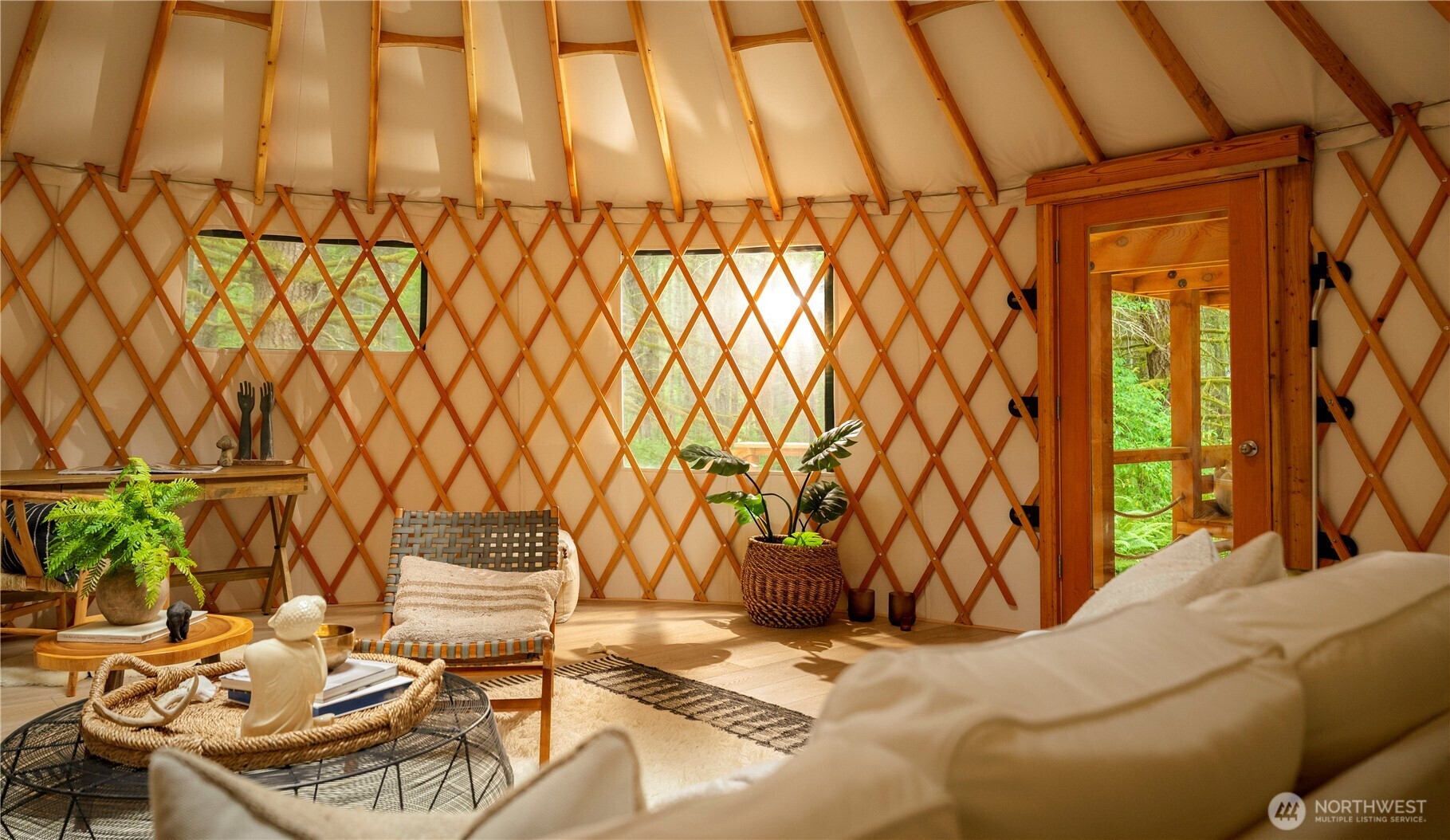 19680 Noll Road Northeast Poulsbo, WA 98370 - Photo 22 of 37 a living room with a couch and a chandelier