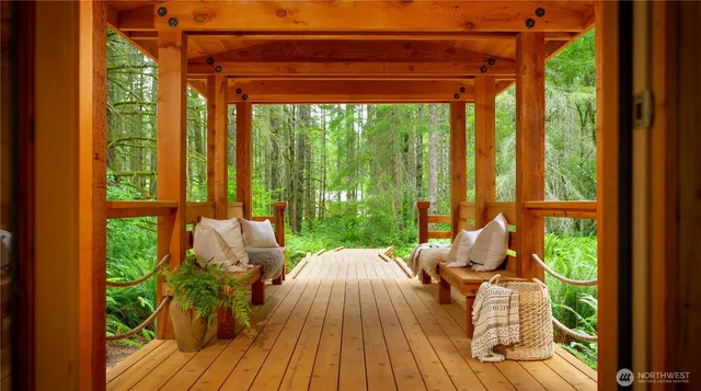 a view of deck with furniture and garden