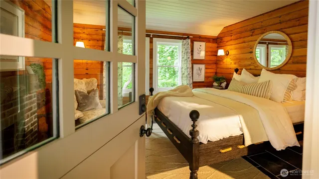 a view of backyard with garden and tall trees