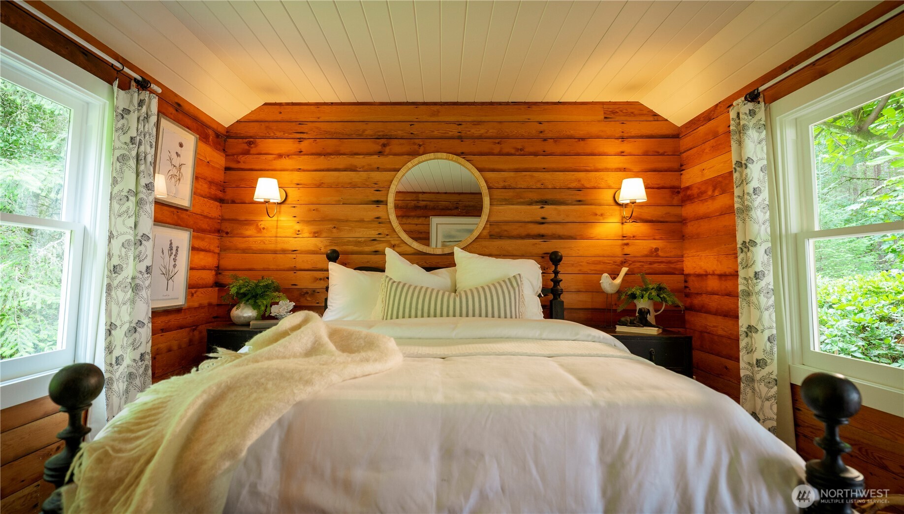 19680 Noll Road Northeast Poulsbo, WA 98370 - Photo 9 of 37 a bedroom with a bed and a large window