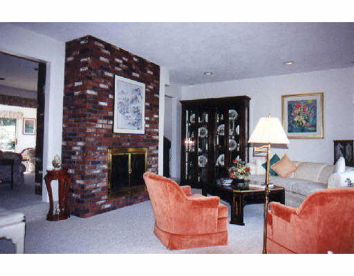 150 Shaw Road Brookline, MA 02467 - Photo 1 of 1 a living room with furniture a fireplace and wall painting