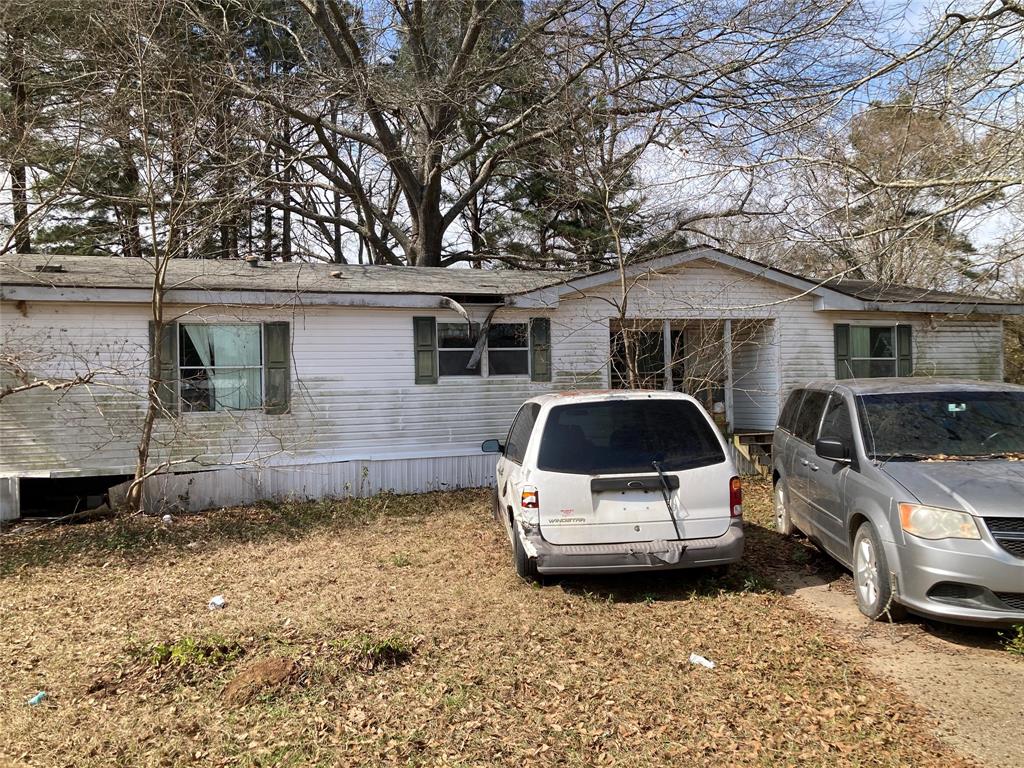 100 Maplewood Drive Haughton, LA 71037 - Photo 1 of 1 a car parked in front of white house