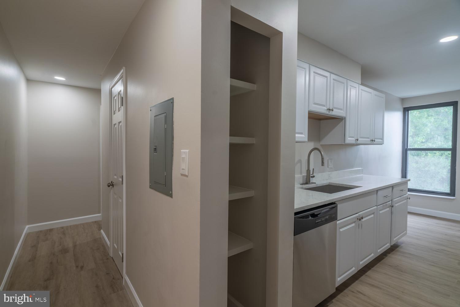 112 Duvall Lane, Unit 304 Gaithersburg, MD 20877 - Photo 13 of 27 a kitchen with stainless steel appliances granite countertop a sink a stove and a refrigerator