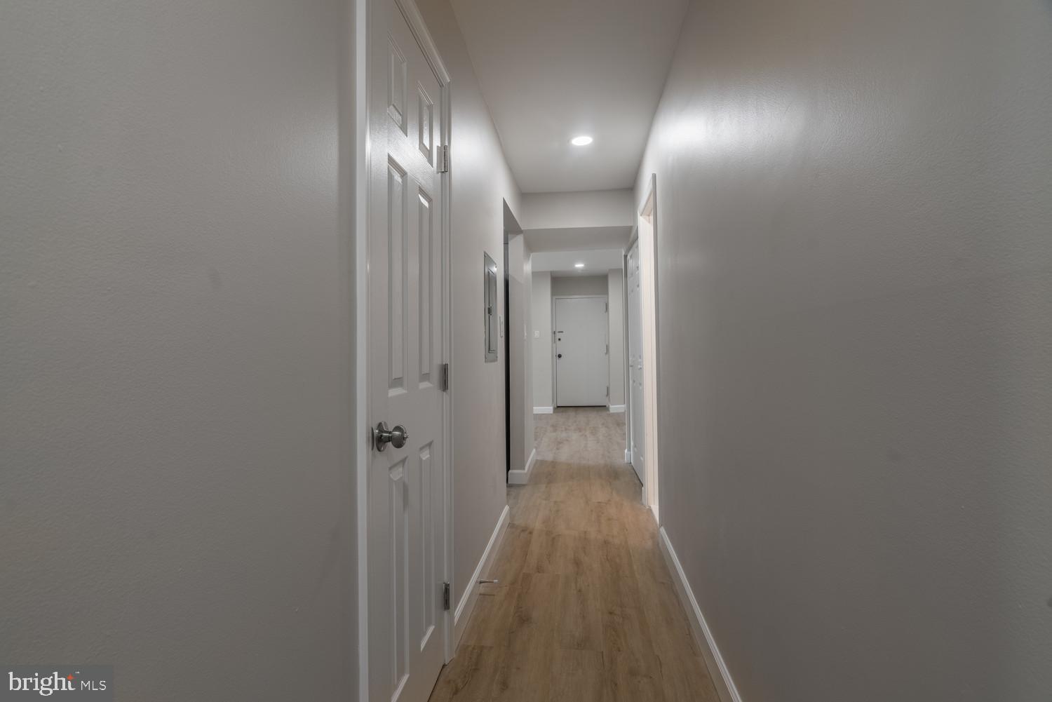 112 Duvall Lane, Unit 304 Gaithersburg, MD 20877 - Photo 15 of 27 a view of a hallway with wooden floor