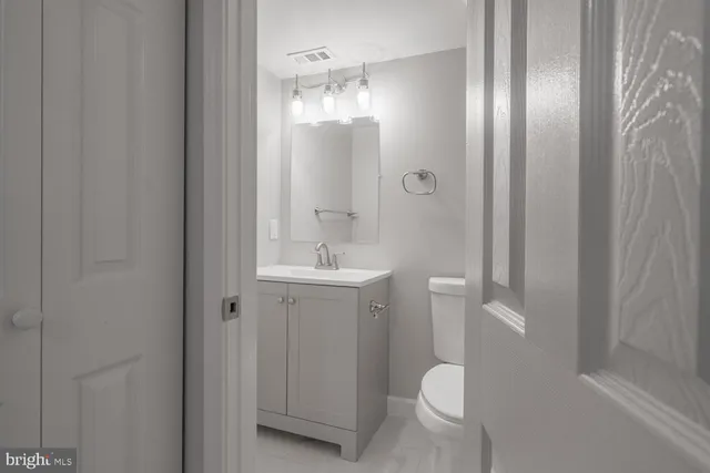 a bathroom with a sink and toilet