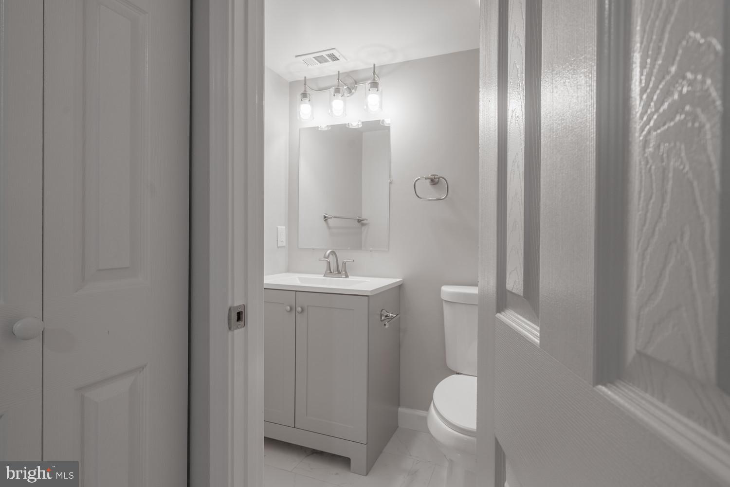 112 Duvall Lane, Unit 304 Gaithersburg, MD 20877 - Photo 18 of 27 a bathroom with a sink and toilet