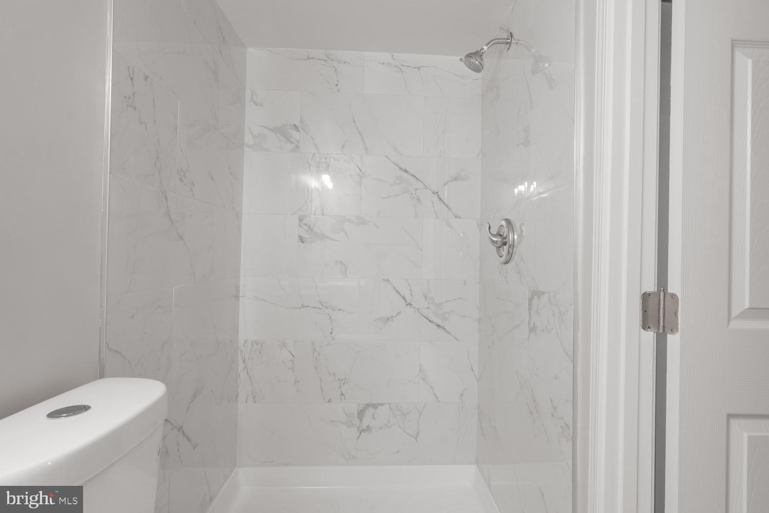 112 Duvall Lane, Unit 304 Gaithersburg, MD 20877 - Photo 19 of 27 a bathroom with a shower and toilet