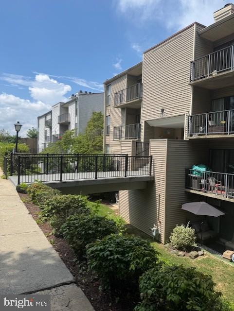 112 Duvall Lane, Unit 304 Gaithersburg, MD 20877 - Photo 2 of 27 a house with river in front of it