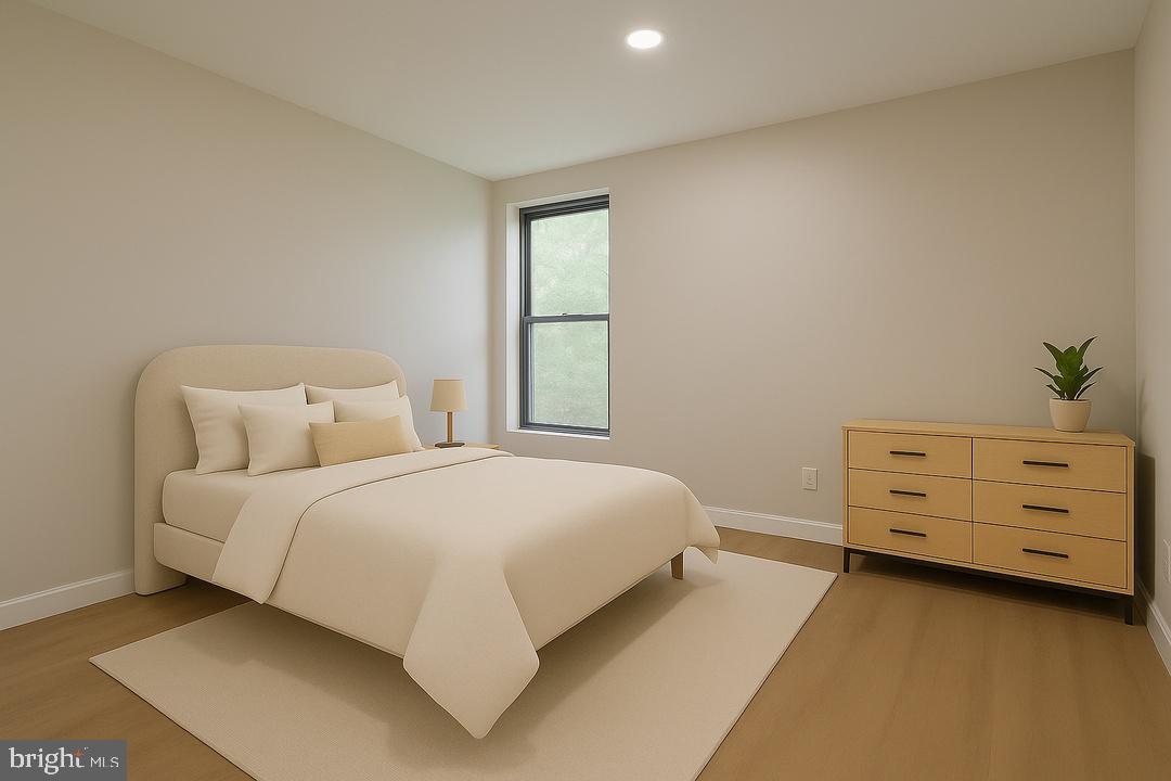 112 Duvall Lane, Unit 304 Gaithersburg, MD 20877 - Photo 22 of 27 a bed room with a bed and a window