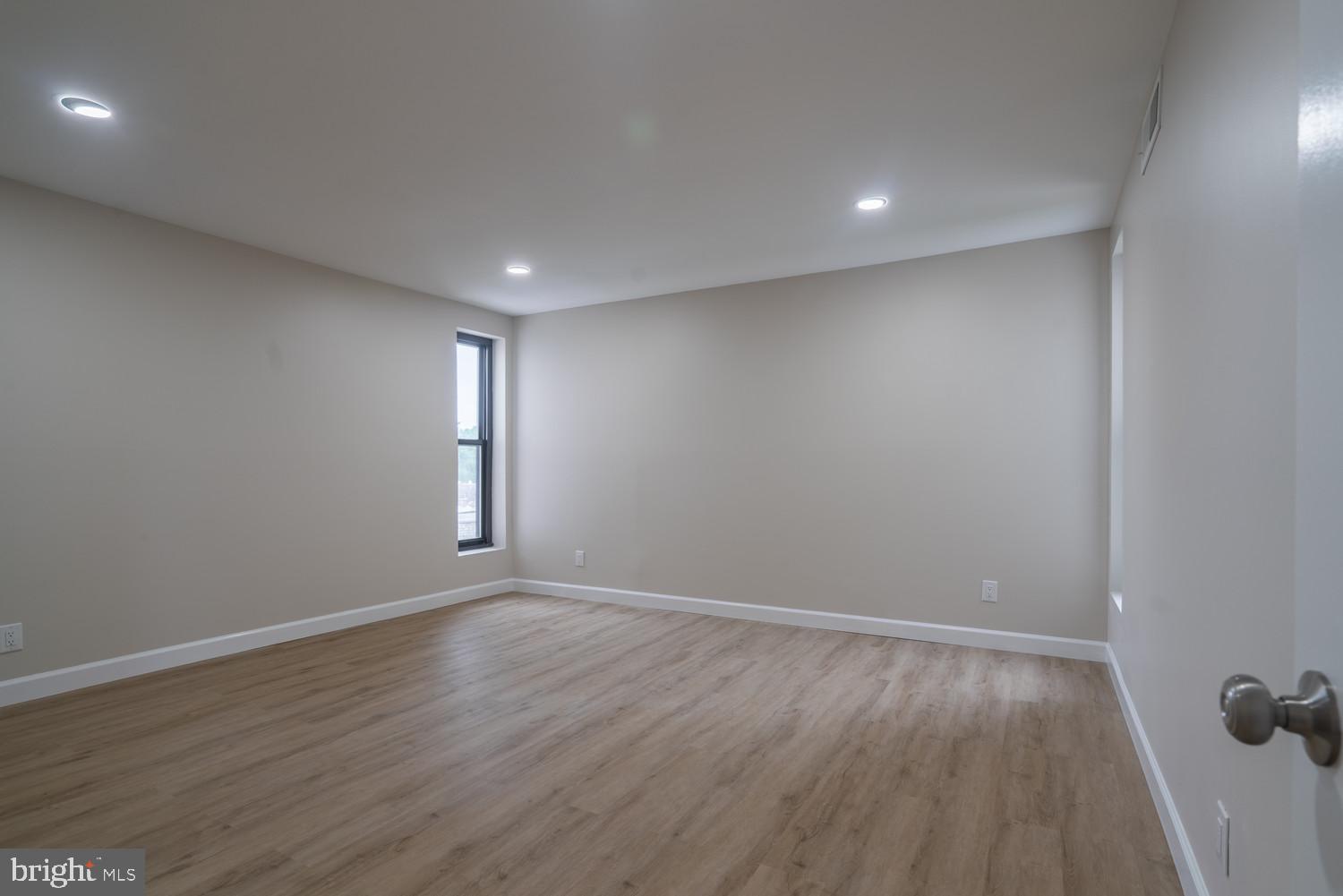 112 Duvall Lane, Unit 304 Gaithersburg, MD 20877 - Photo 25 of 27 a view of an empty room and wooden floor