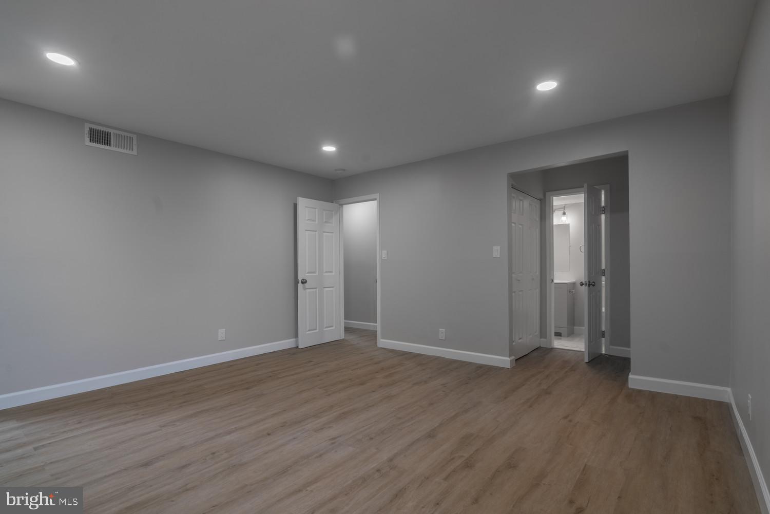 112 Duvall Lane, Unit 304 Gaithersburg, MD 20877 - Photo 26 of 27 a view of an empty room with wooden floor