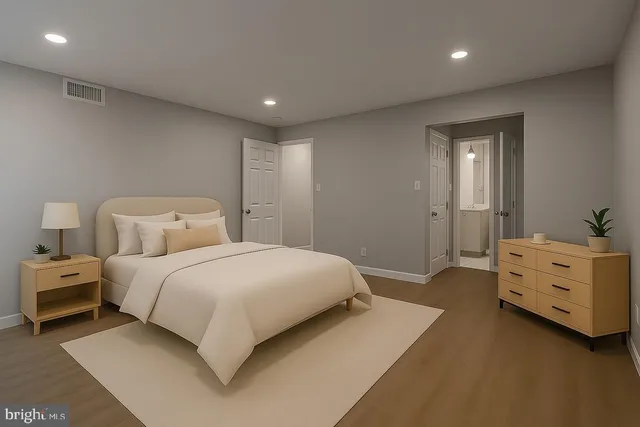 a bedroom with a bed and a dresser
