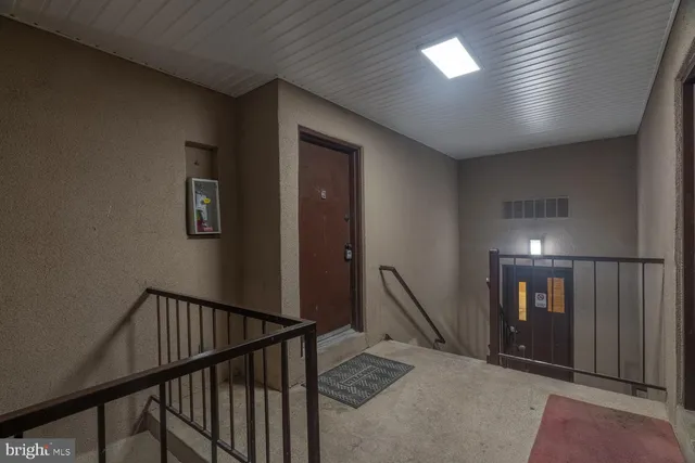 a view of a hallway with staircase