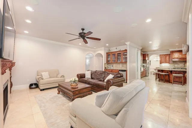 a dining area with stainless steel appliances kitchen island granite countertop a table and chairs