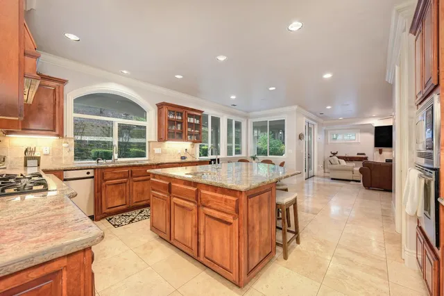a view of a room with furniture and a ceiling fan