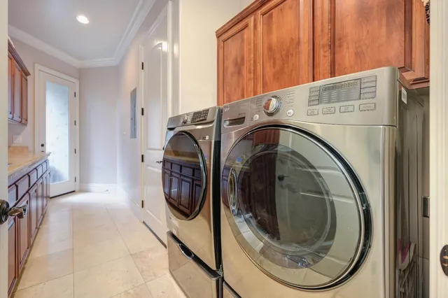 a spacious bedroom with a bed and ceiling fan