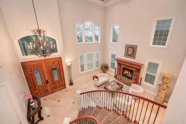 a view of a bathroom with tub shower and bedroom