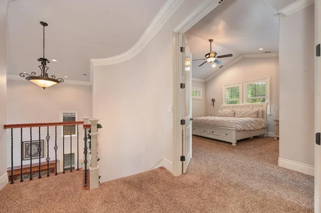 a large bathroom with a granite countertop double vanity sink a mirror and a bathtub
