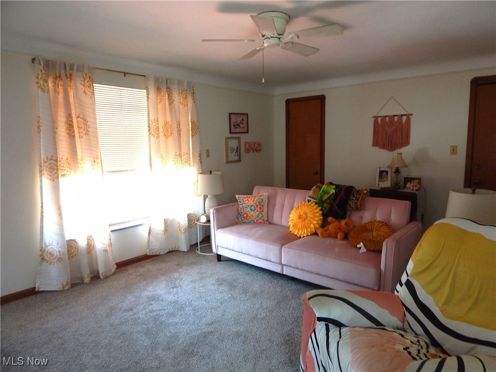 3211 Warren Road Cleveland, OH 44111 - Photo 13 of 32 Spacious Living room with ceiling fan and updated carpet