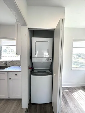 a view of kitchen and bathroom with wooden floor