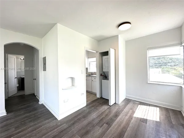a view of a kitchen cabinets and wooden floor