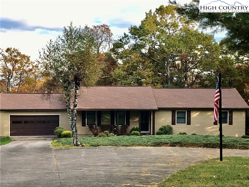 1307 Ben Miller Road Deep Gap, NC 28618 - Photo 1 of 26 a front view of a house with garden