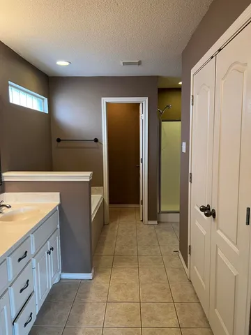 a view of a hallway with closet